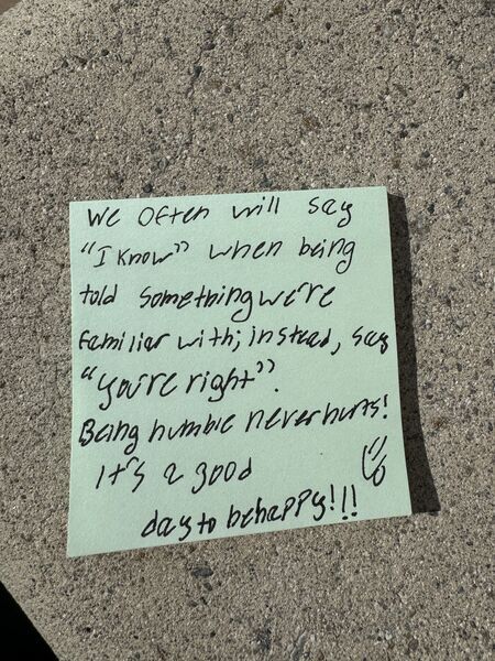 Handwritten sticky note with words of encouragement